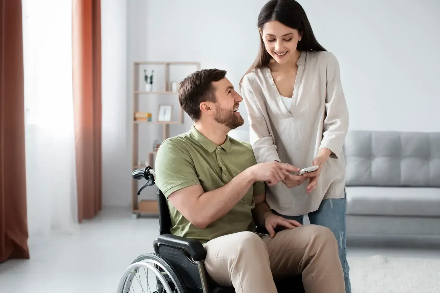 Support worker helping a young adult build confidence and independence
