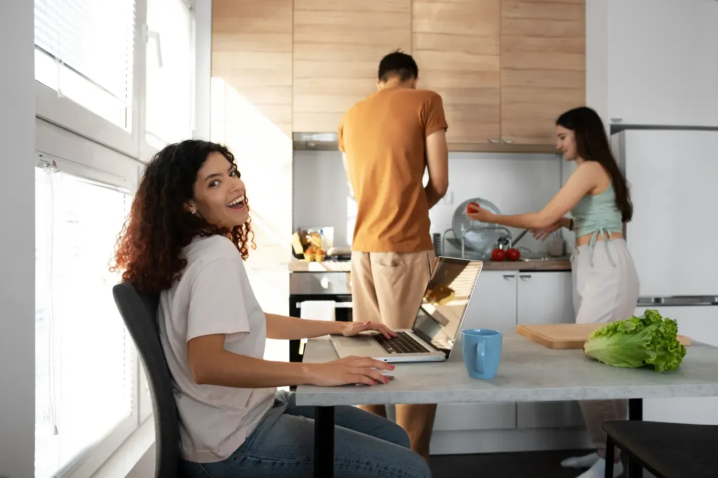 People sharing a home-style kitchen environment together